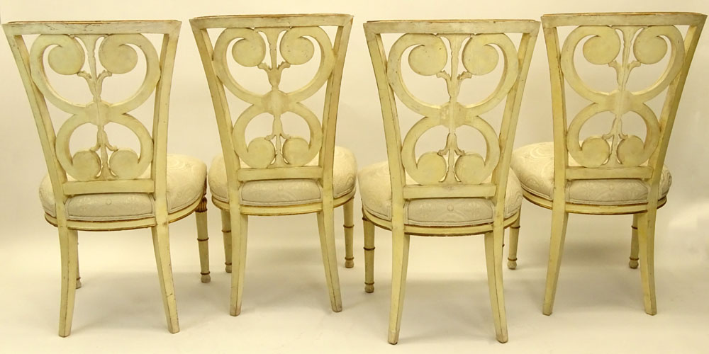 Set of Four (4) Mid 20th Century Italian Neoclassical style Carved Painted and Parcel Gilt Side Chairs.