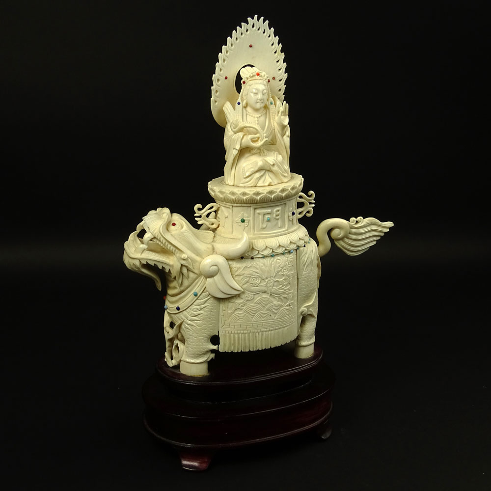 Vintage Chinese Carved Ivory on Hardwood Stand "Deity On Foo Lion" Inset with turquoise and coral beads. 