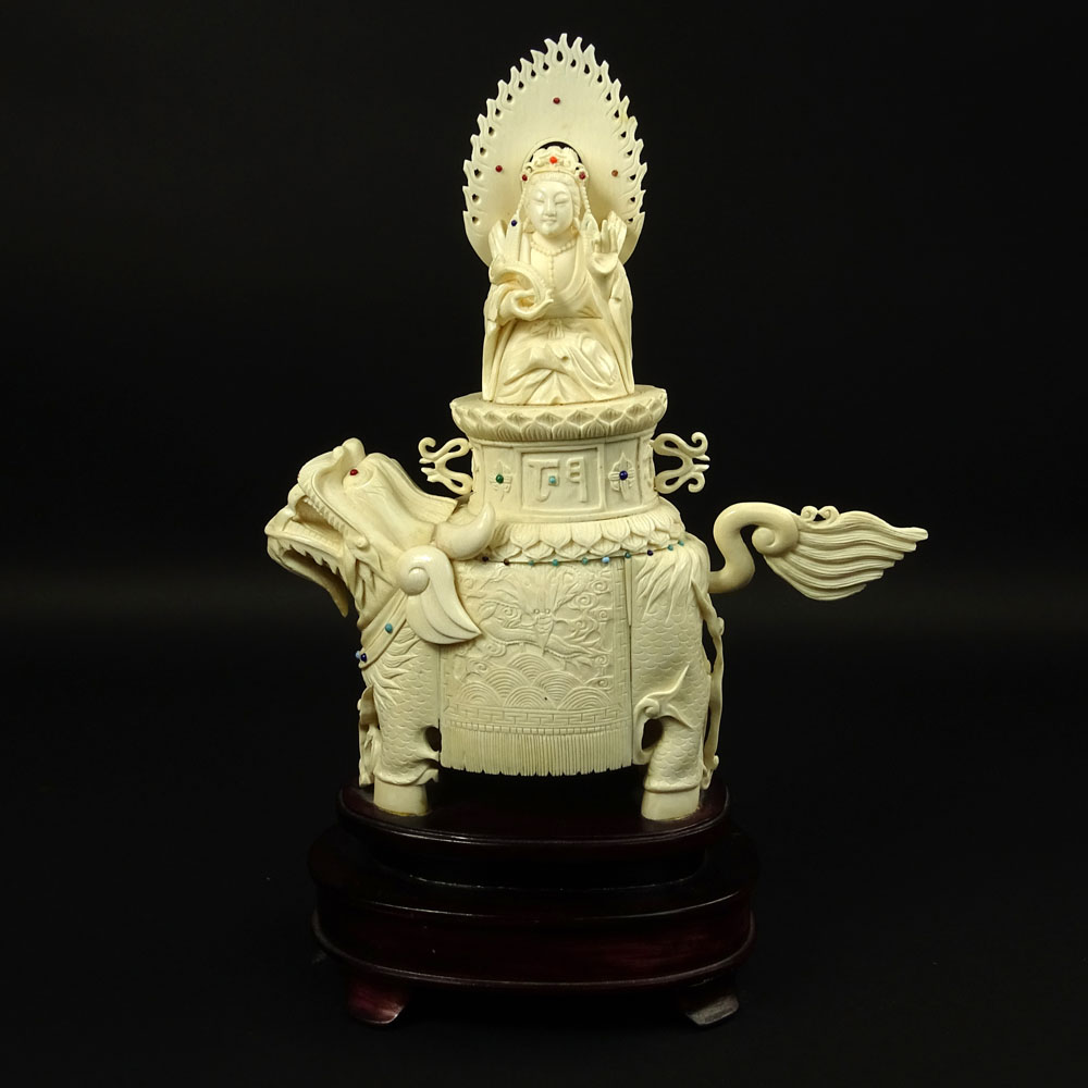 Vintage Chinese Carved Ivory on Hardwood Stand "Deity On Foo Lion" Inset with turquoise and coral beads. 