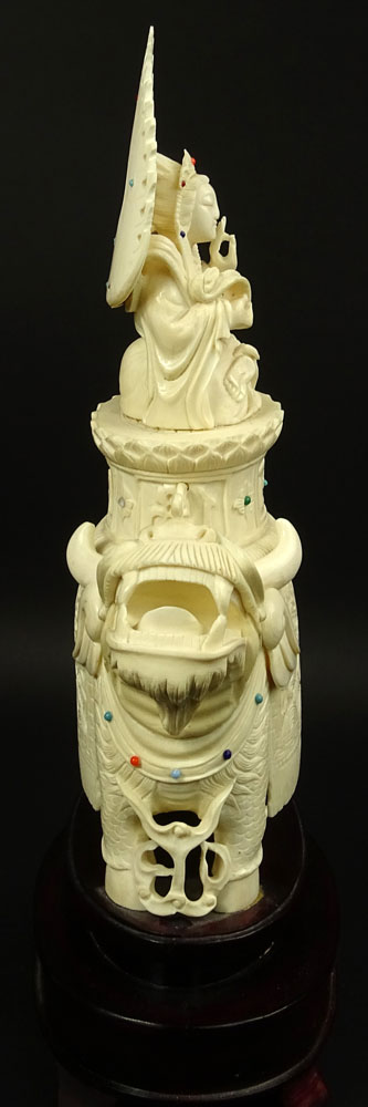 Vintage Chinese Carved Ivory on Hardwood Stand "Deity On Foo Lion" Inset with turquoise and coral beads. 