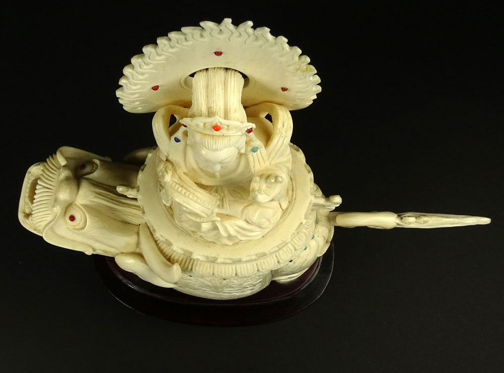 Vintage Chinese Carved Ivory on Hardwood Stand "Deity On Foo Lion" Inset with turquoise and coral beads. 