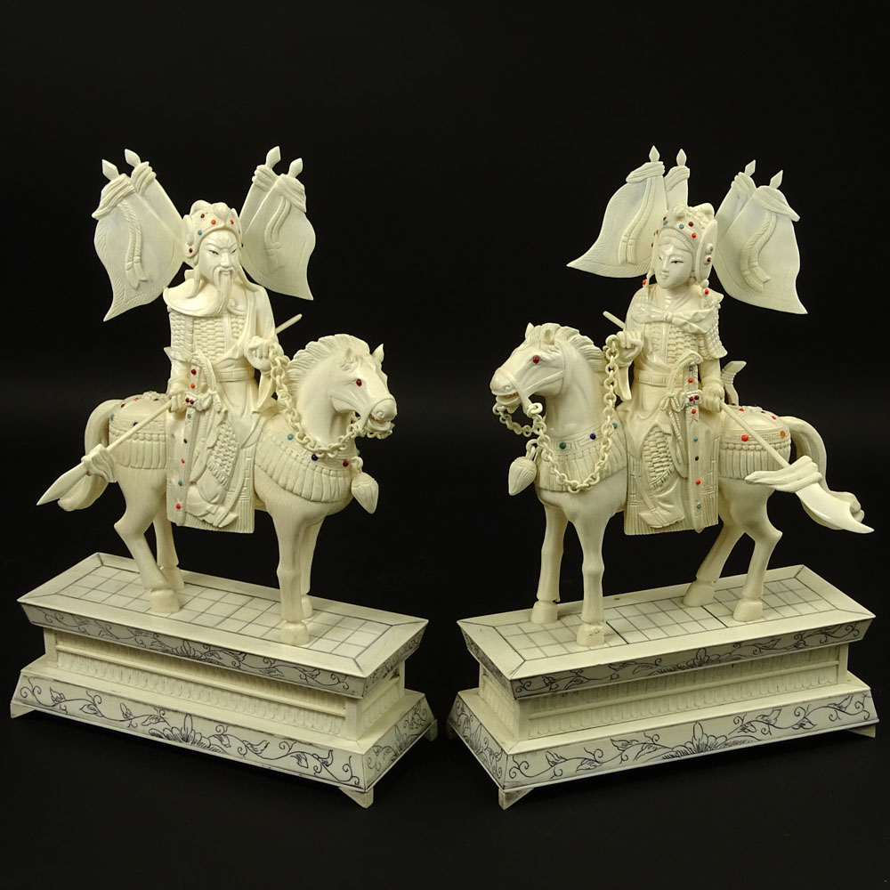 Pair of Vintage Chinese Carved Ivory Figurines "Royal Guards On Horses" Inset with turquoise and coral beads. 