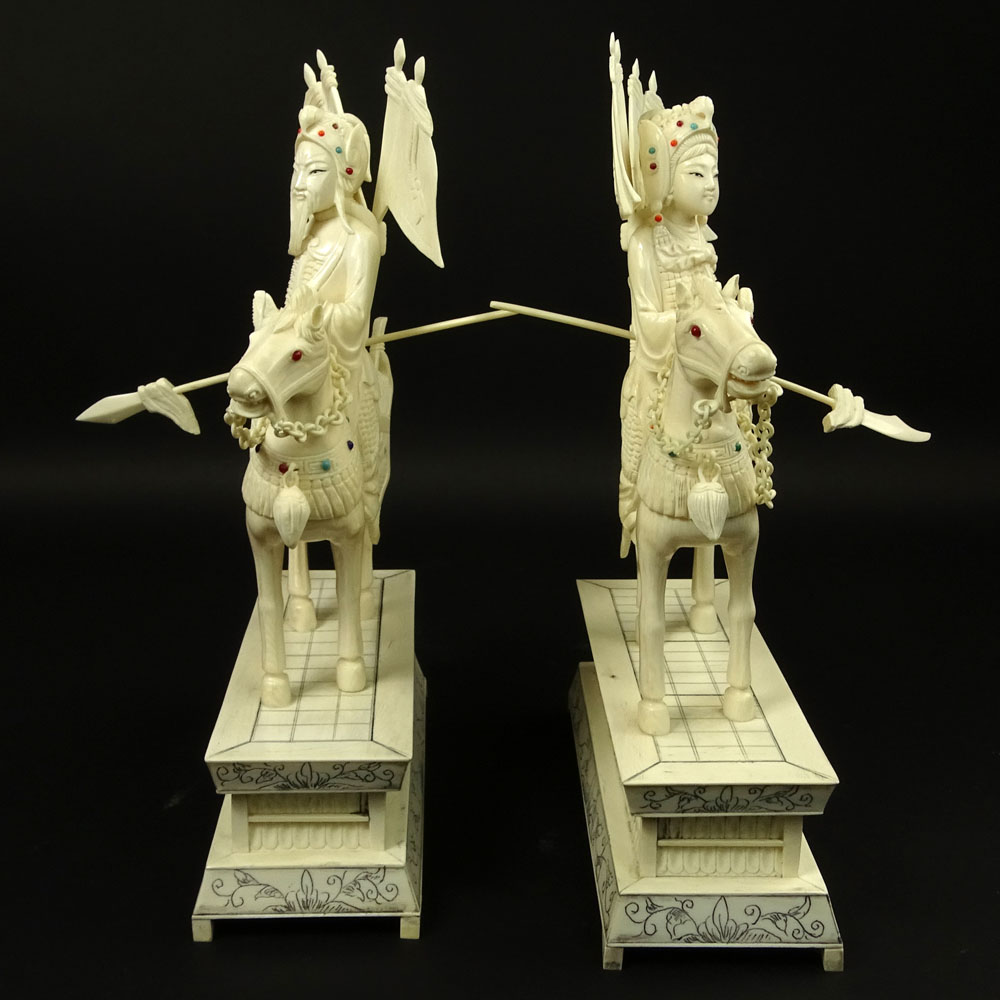 Pair of Vintage Chinese Carved Ivory Figurines "Royal Guards On Horses" Inset with turquoise and coral beads. 