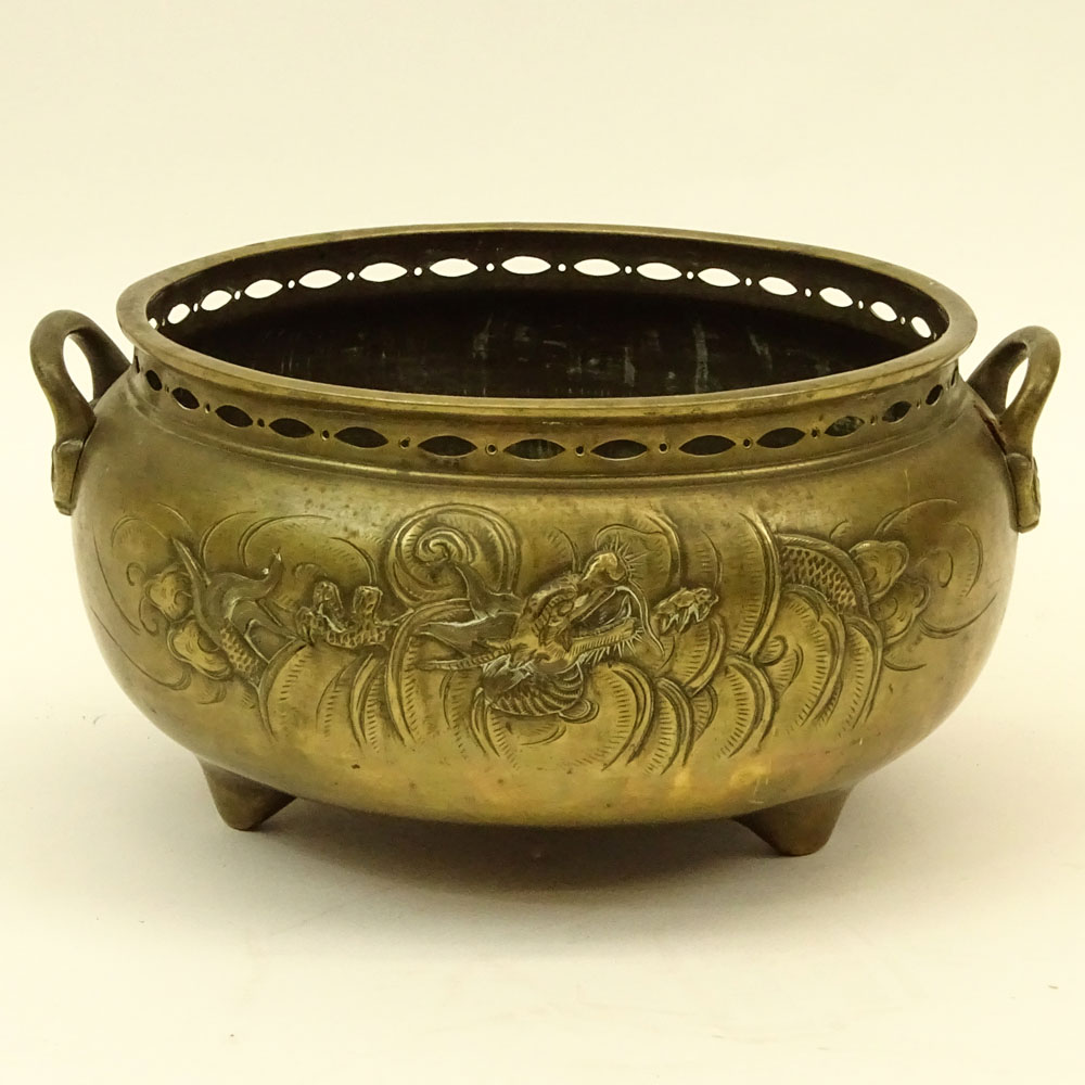 Large 18/19th Century Chinese Bronze Censer. Tri-Footed relief of dragons and clouds motif. Pierced rim.