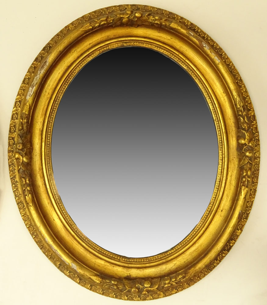 Pair of Gilt Carved Oval Mirrors.