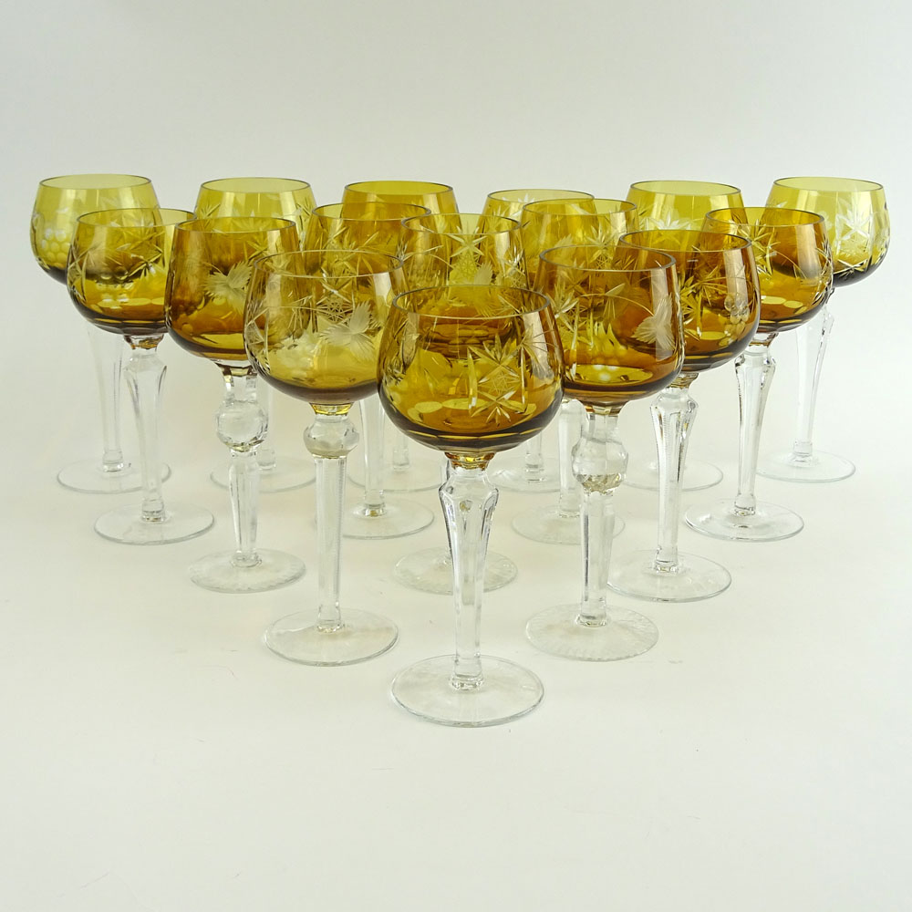 Lot of 16 Bohemian Cut Glass Wine Hocks in Amber. Various stems.