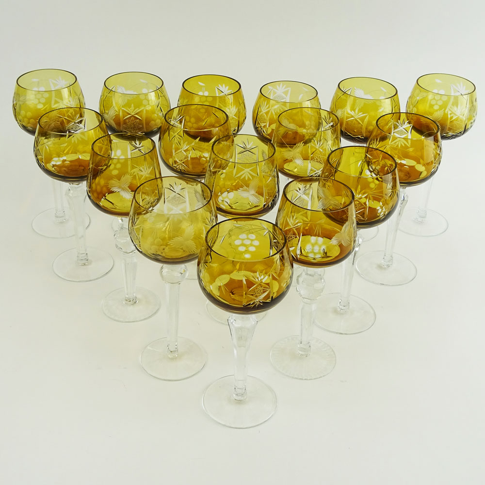 Lot of 16 Bohemian Cut Glass Wine Hocks in Amber. Various stems.