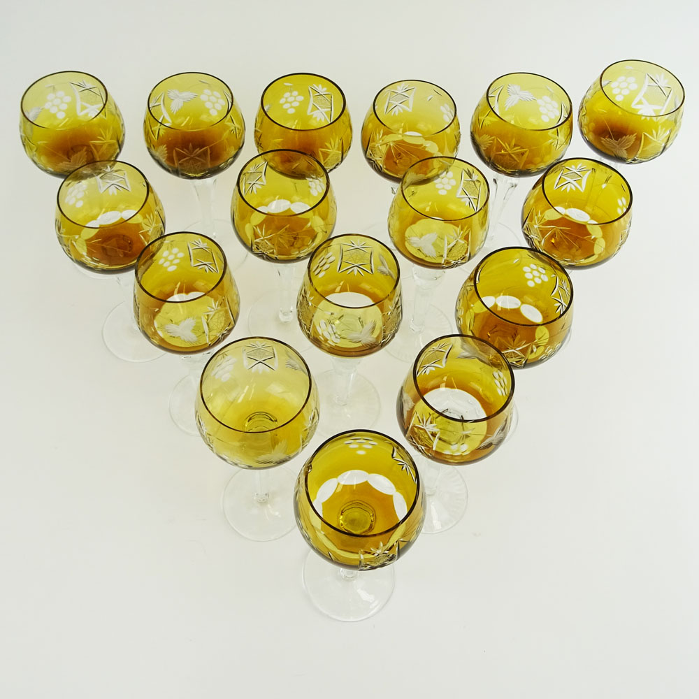 Lot of 16 Bohemian Cut Glass Wine Hocks in Amber. Various stems.