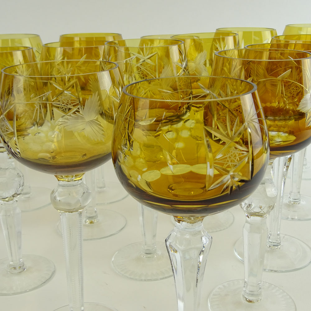 Lot of 16 Bohemian Cut Glass Wine Hocks in Amber. Various stems.