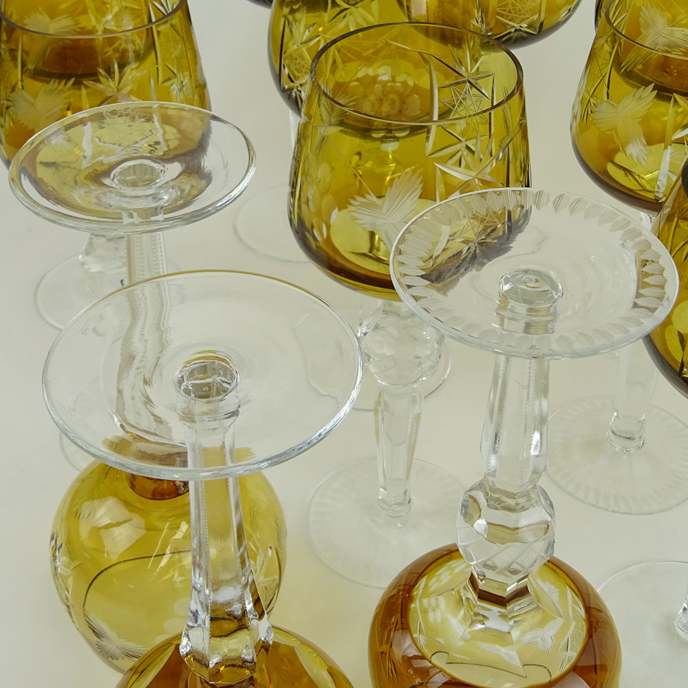 Lot of 16 Bohemian Cut Glass Wine Hocks in Amber. Various stems.