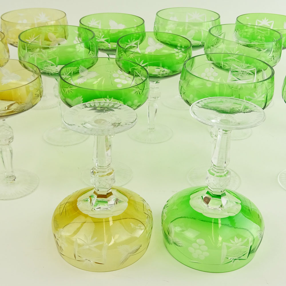 Lot of 17 Bohemian Cut Glass Champagne Coupes in Green (12) and Amber (5).