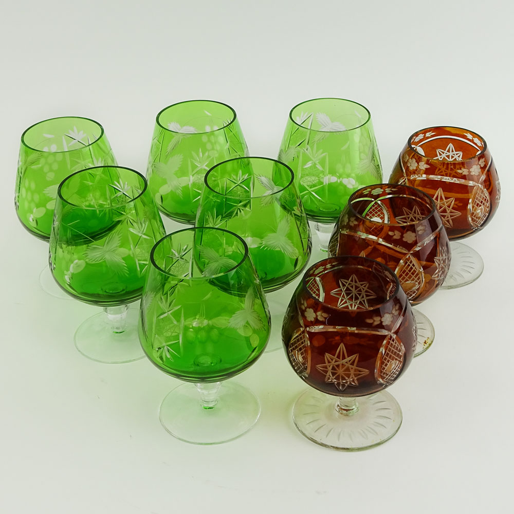 Lot of 9 Bohemian Cut Glass Brandy glasses in Green and Deep Orange.