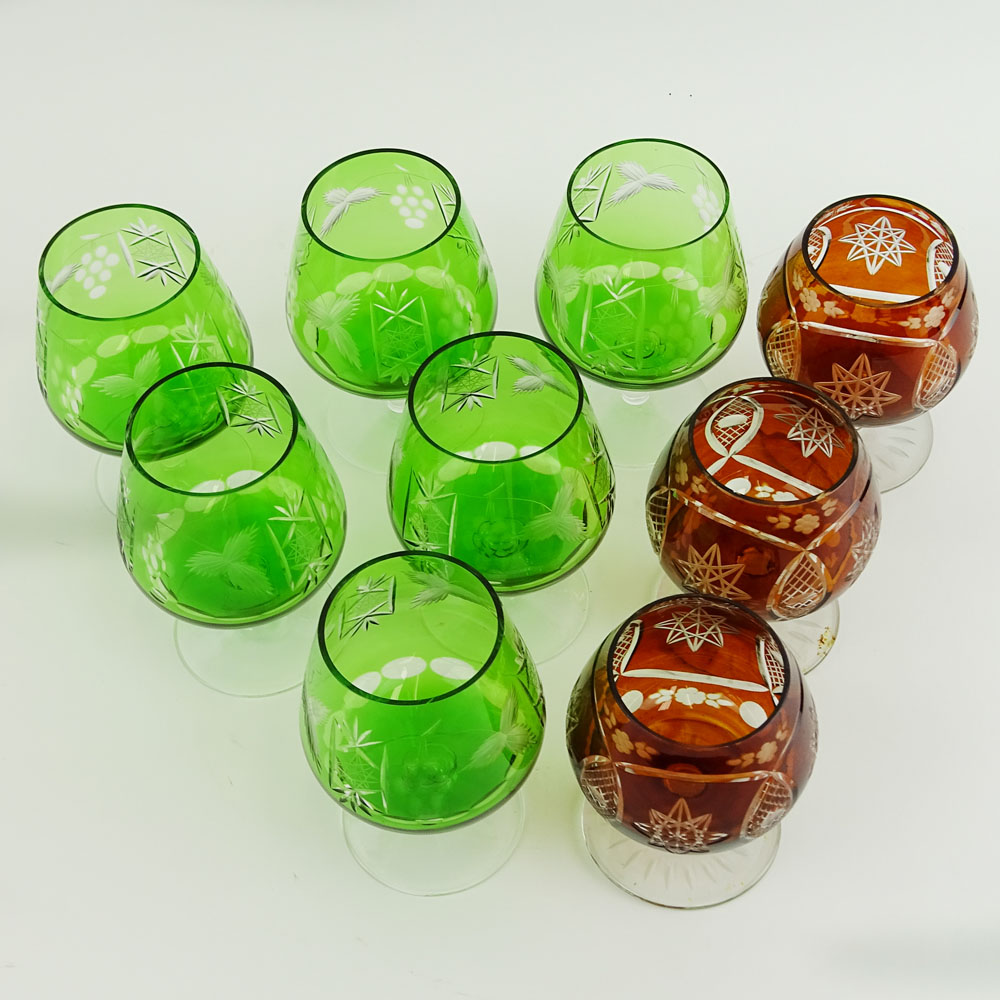 Lot of 9 Bohemian Cut Glass Brandy glasses in Green and Deep Orange.