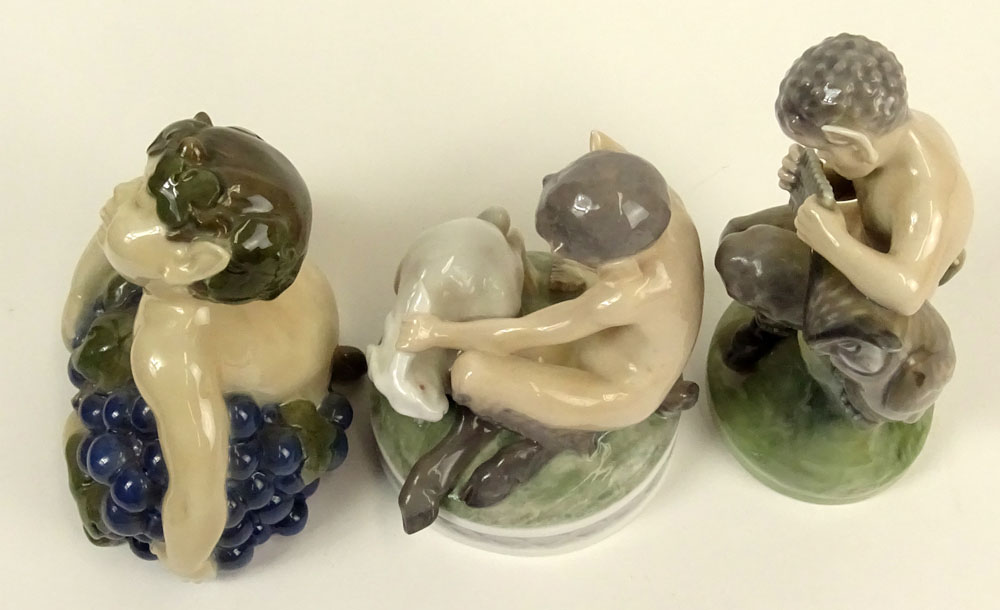Lot of Three (3) Royal Copenhagen Porcelain Satyr Figurines in Various Poses with bunny and flute.