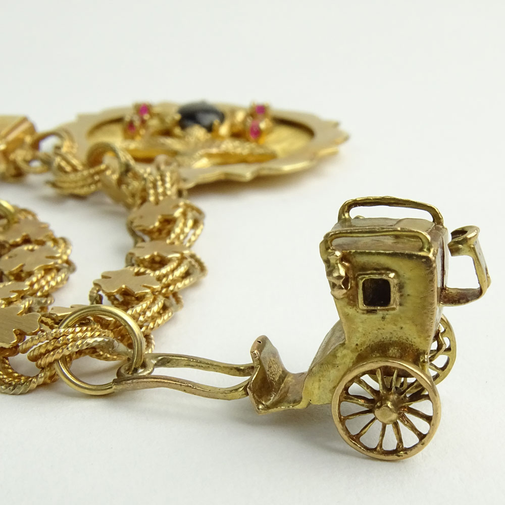 Vintage 14 Karat Yellow Gold Charm Bracelet with Four (4) Charms.