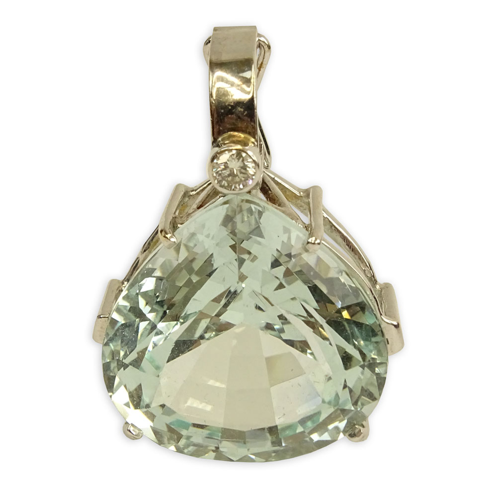 Large Heart Shape Aquamarine and 14 Karat White Gold Pendant with Round Cut Diamond Accent.