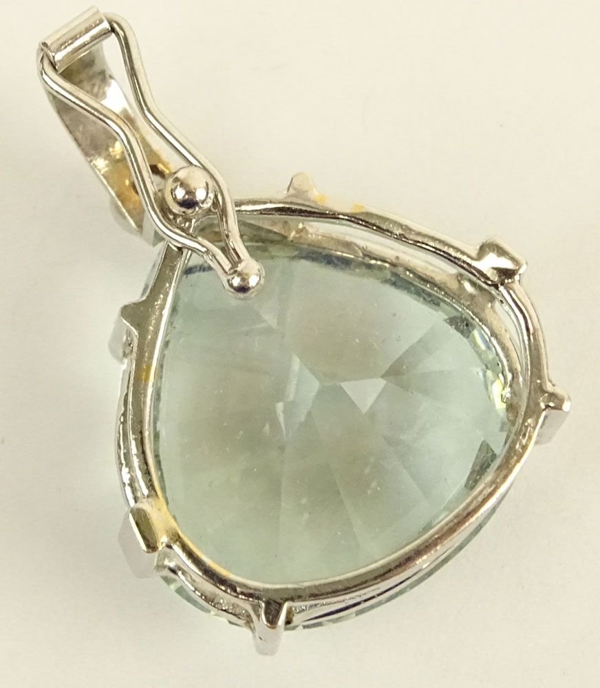 Large Heart Shape Aquamarine and 14 Karat White Gold Pendant with Round Cut Diamond Accent.