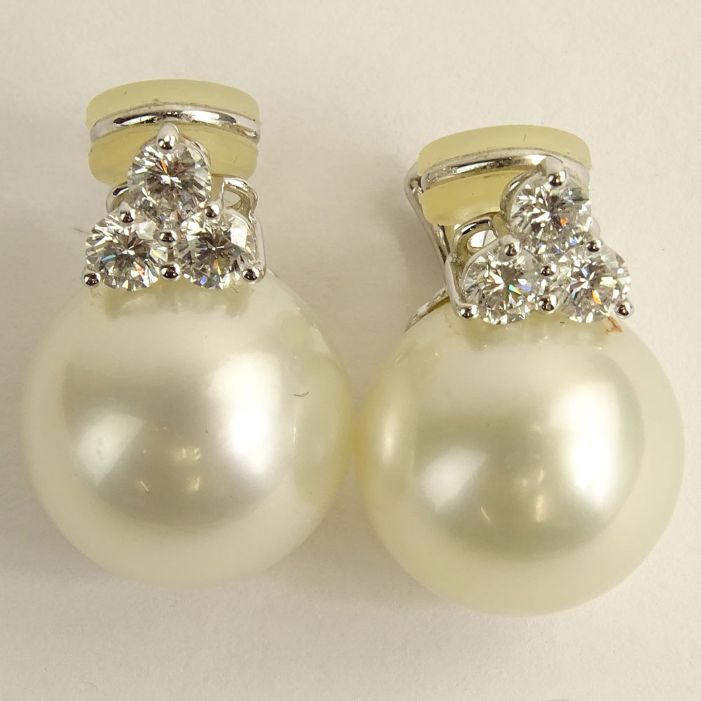 Pair of 15.6-15.9mm South Sea Pearl and 18 Karat White Gold Earclips with Three (3) Round Brilliant Cut Diamonds.