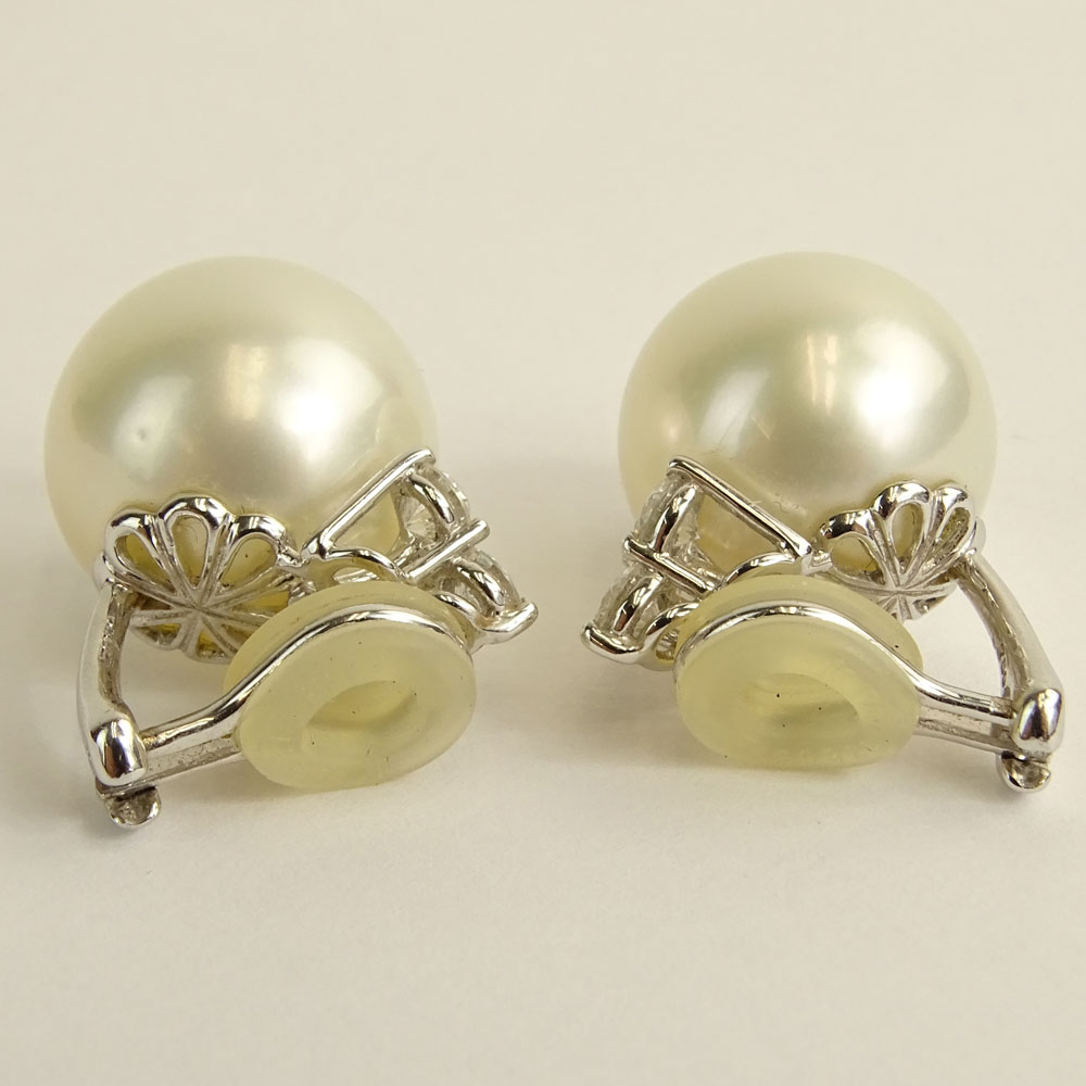 Pair of 15.6-15.9mm South Sea Pearl and 18 Karat White Gold Earclips with Three (3) Round Brilliant Cut Diamonds.