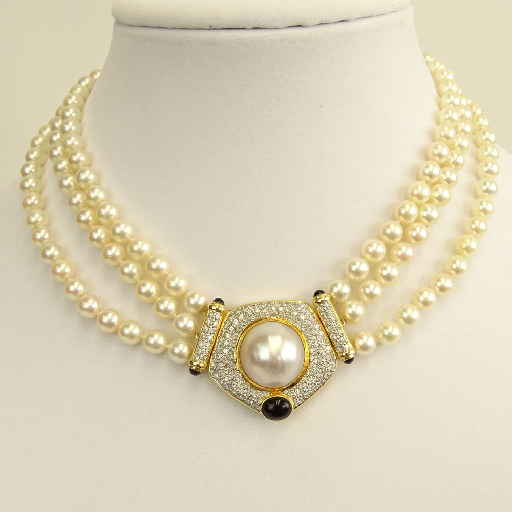 Vintage Three (3) Strand White Pearl Necklace with 14 Karat Yellow Gold Clasp.