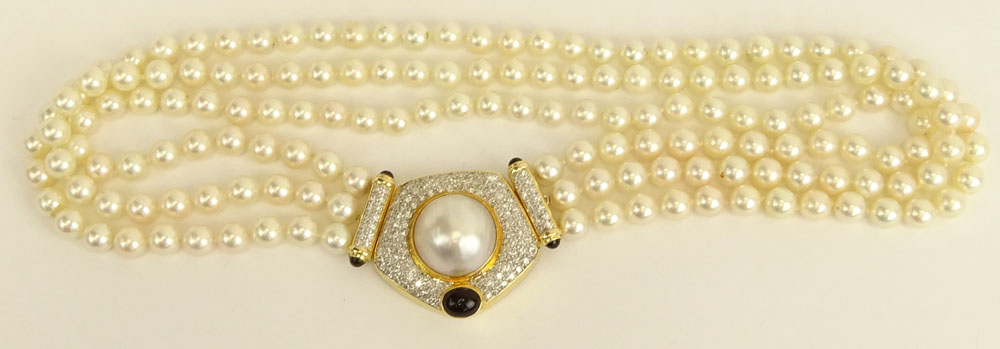 Vintage Three (3) Strand White Pearl Necklace with 14 Karat Yellow Gold Clasp.