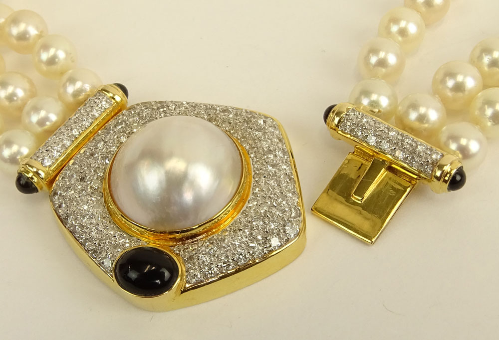 Vintage Three (3) Strand White Pearl Necklace with 14 Karat Yellow Gold Clasp.