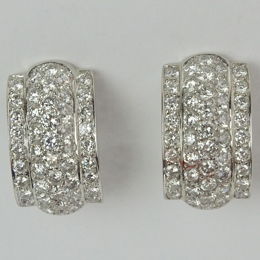 Pair of 5.73 Carat Pave Set Round Cut Diamond and 18 Karat White Gold Half Moon Shape Earclips.