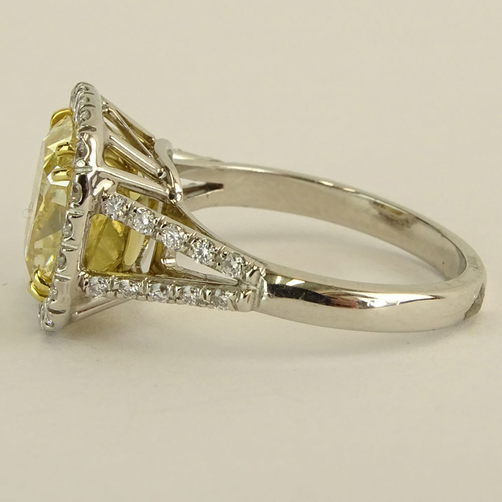 5.03 Carat Radiant Cut Fancy Intense Yellow Diamond, Platinum and 18 Karat Yellow Gold Engagement Ring 