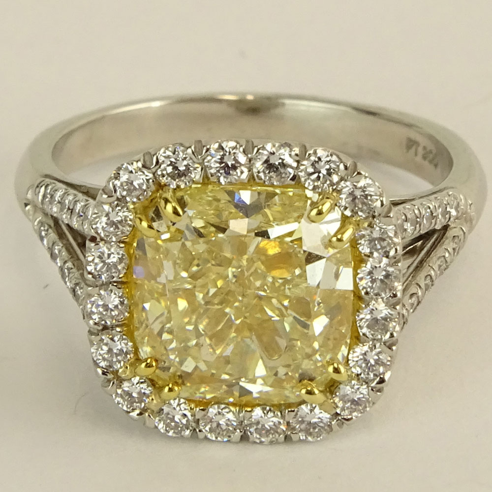 5.03 Carat Radiant Cut Fancy Intense Yellow Diamond, Platinum and 18 Karat Yellow Gold Engagement Ring 