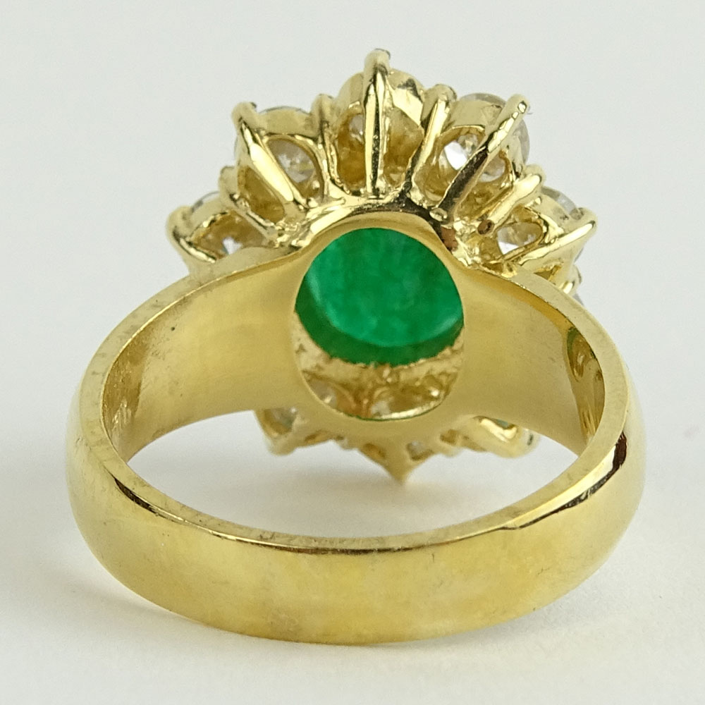 Lady's 4.00 Carat Oval Cut Emerald, 1.80 Carat Round Cut Diamond and 14 Karat Yellow Gold Ring. 