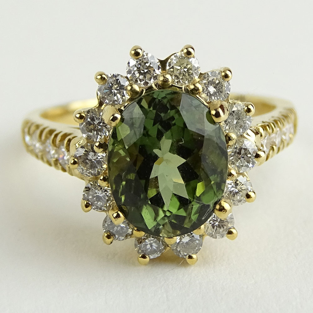 2.35 Carat Oval Cut Green Tourmaline, 1.10 Carat Round Cut Diamond and 14 Karat Yellow Gold Ring.