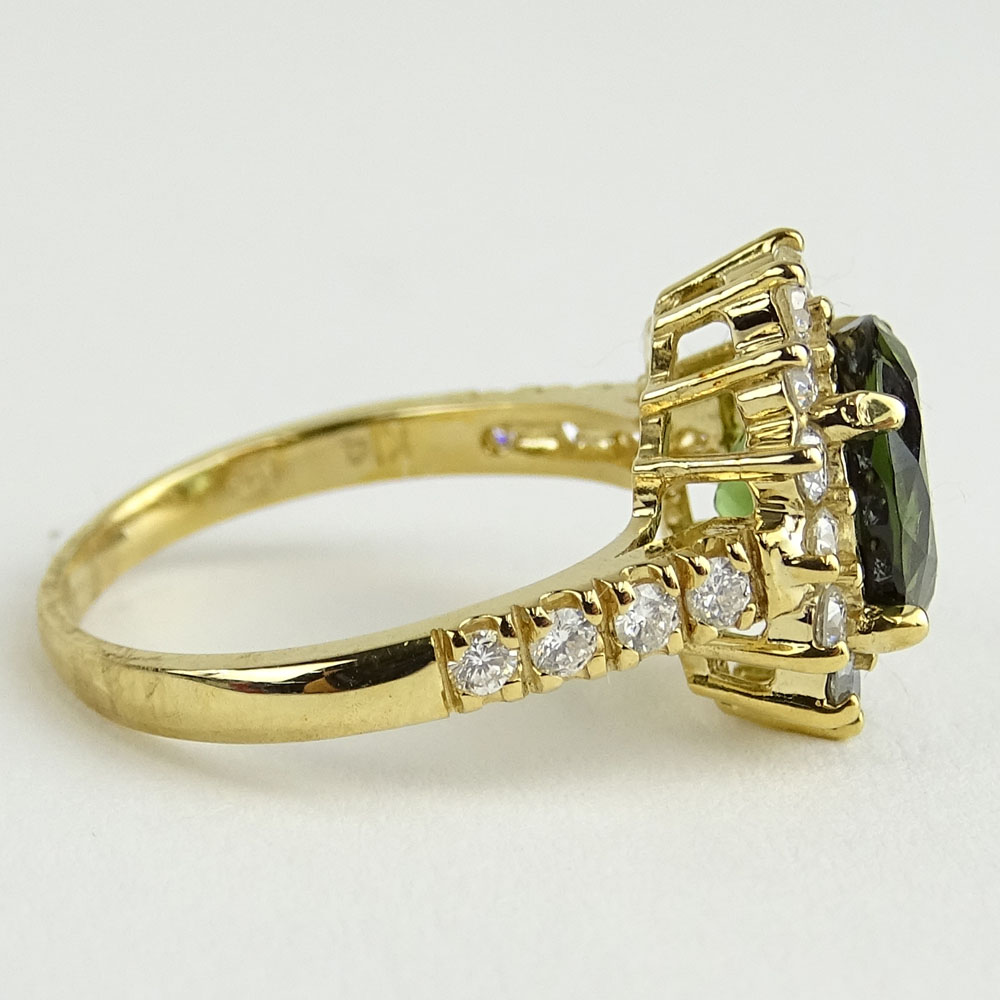 2.35 Carat Oval Cut Green Tourmaline, 1.10 Carat Round Cut Diamond and 14 Karat Yellow Gold Ring.