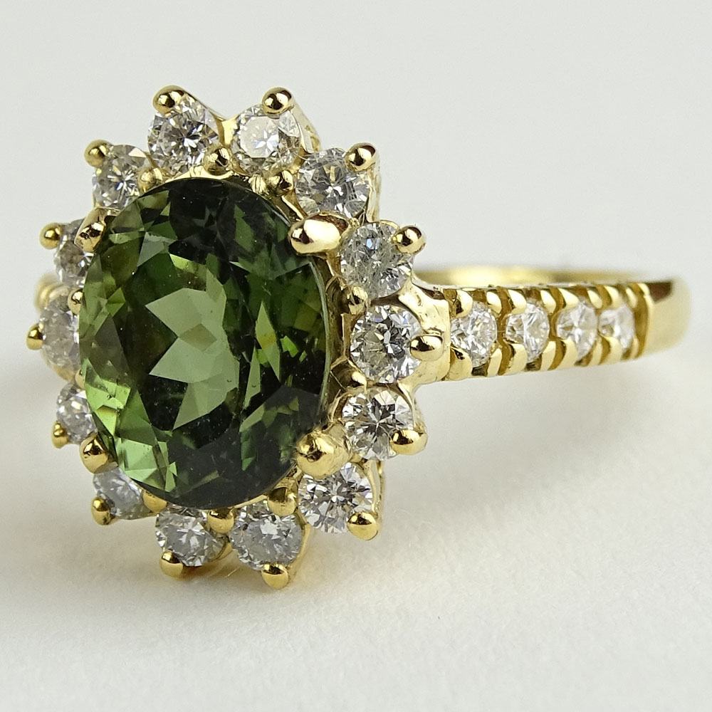 2.35 Carat Oval Cut Green Tourmaline, 1.10 Carat Round Cut Diamond and 14 Karat Yellow Gold Ring.