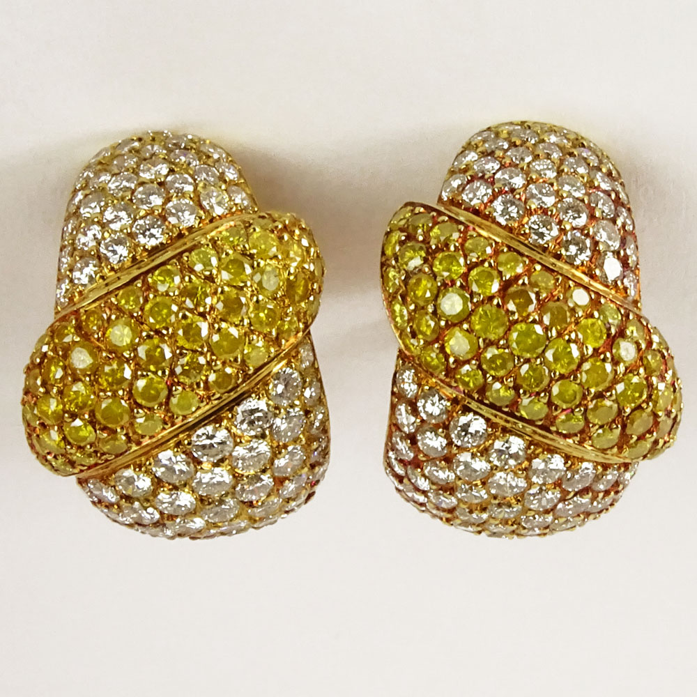 Lady's Approx. 8.50 Carat Fancy Yellow, Round Brilliant Cut Diamond and 18 Karat Yellow Gold Earrings.