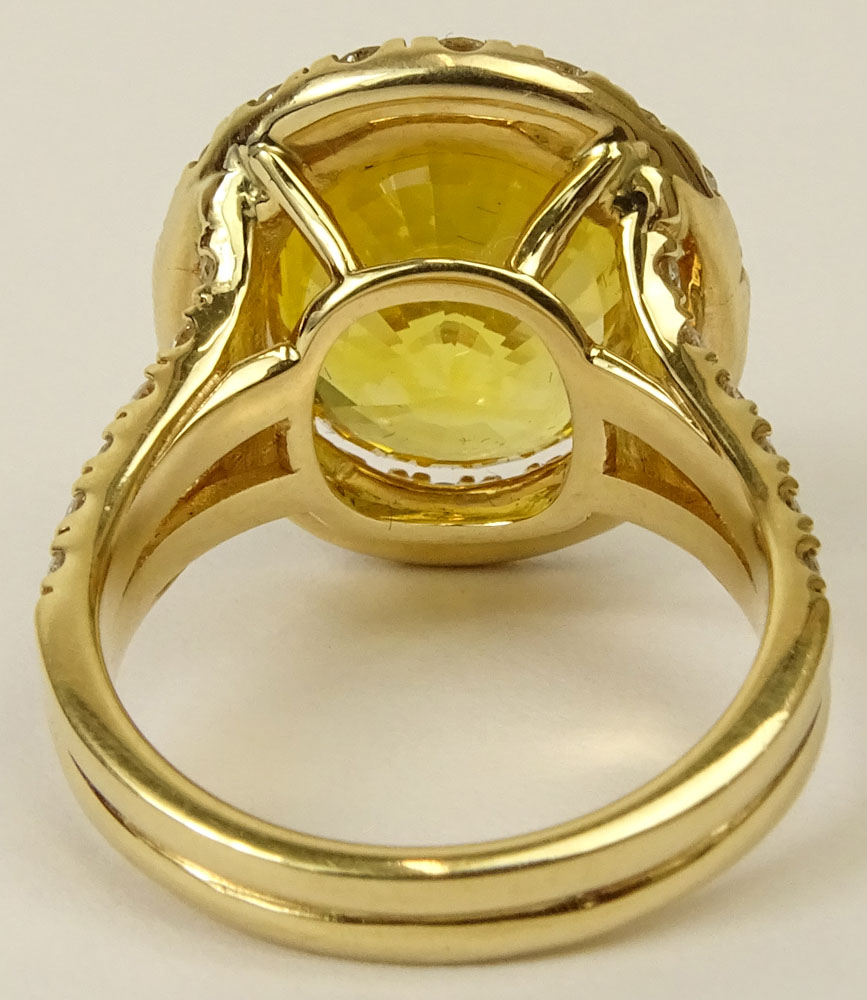 GIA Certified 12.65 Carat Oval Cut Yellow Sapphire and 18 Karat Yellow Gold Ring accented throughout with Round Brilliant Cut Diamonds