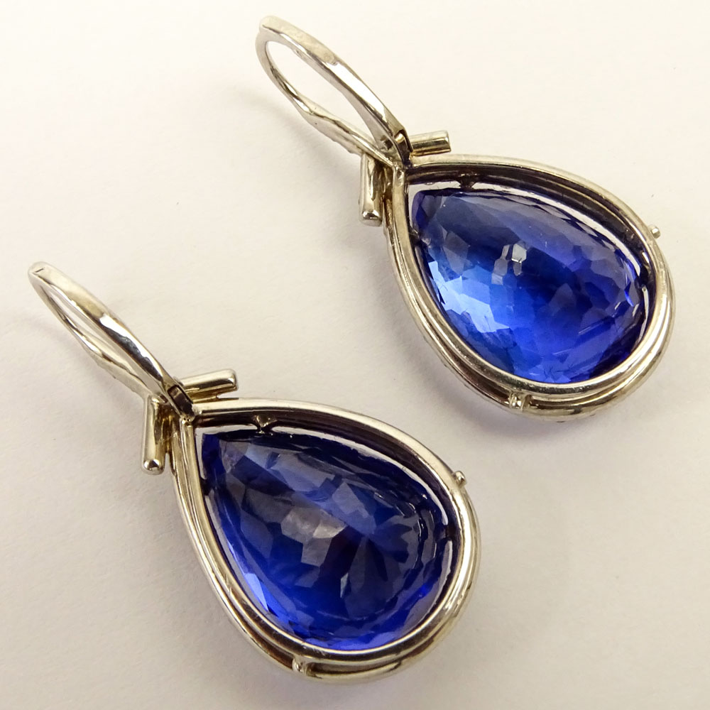 Fine Quality Approx. 21.80 Carat Pear Shape Tanzanite, 1.07 Carat Diamond and 18 Karat White Gold earrings. 