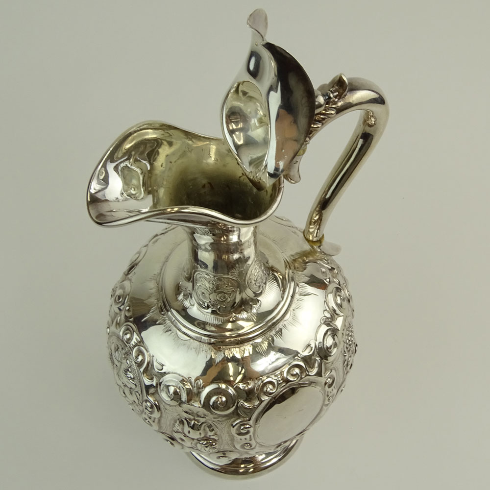 Mid 19th Century English Silver Ewer. Fruit and foliate motif.