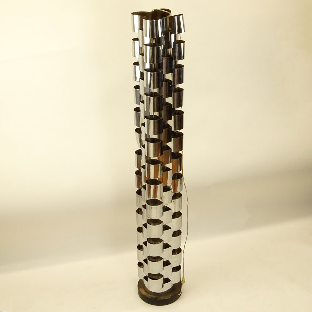 Curtis JerÈ, American (20th C) Chromed metal and ebonized wood tall floor lamp. 