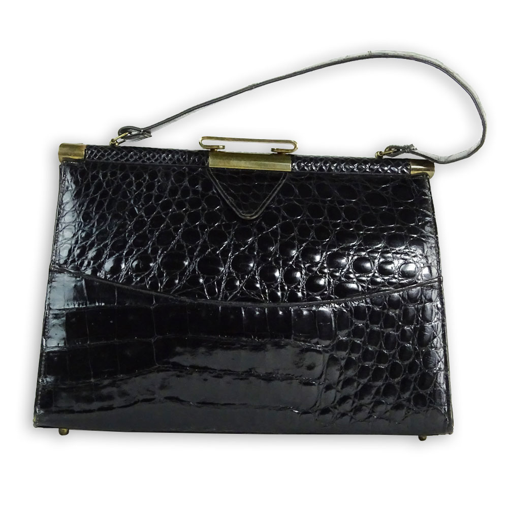 Vintage Alligator Handbag. Rich black color. Leather interior.