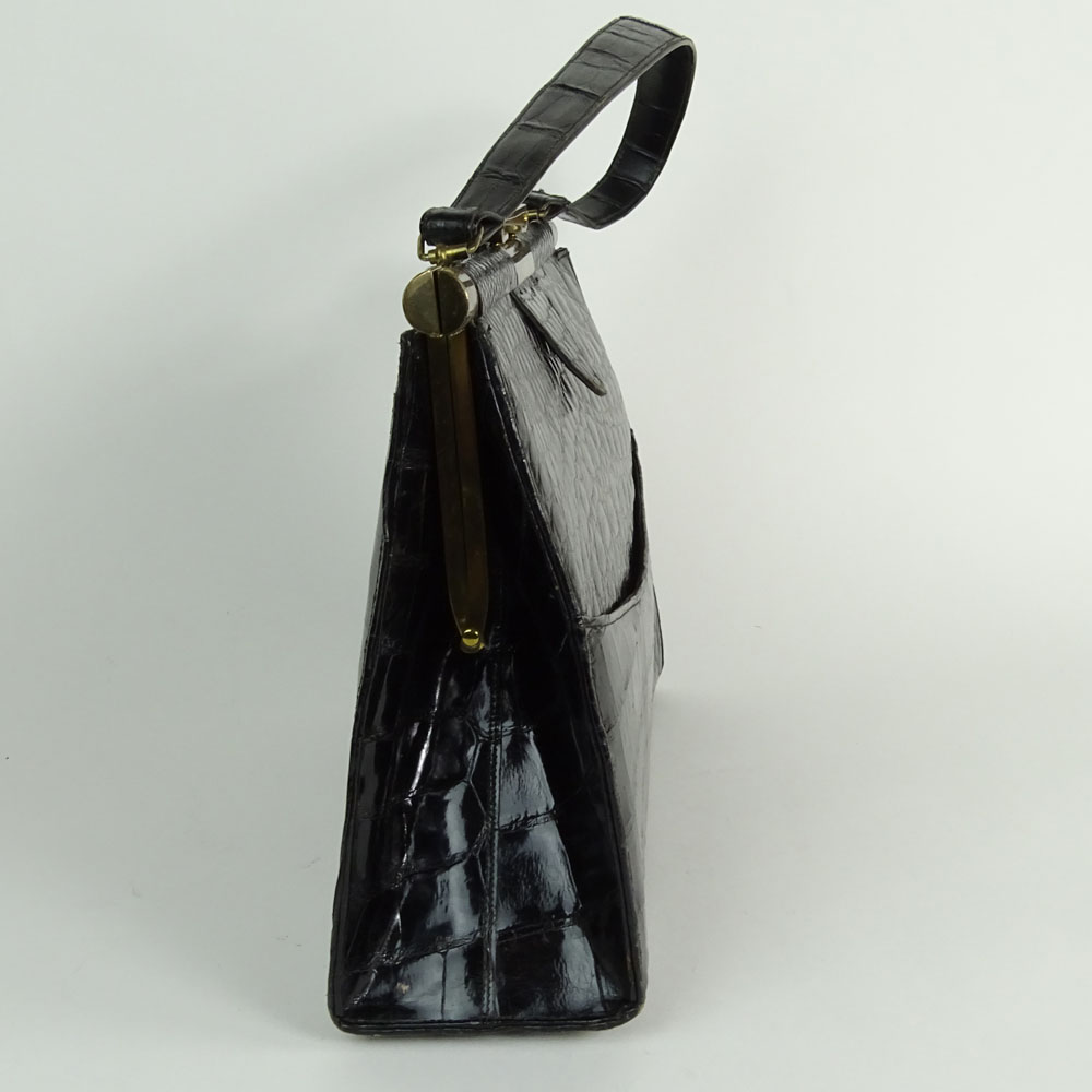 Vintage Alligator Handbag. Rich black color. Leather interior.