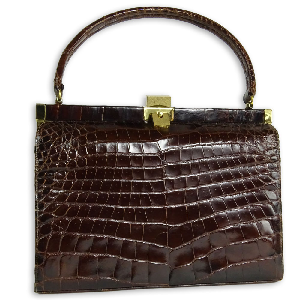 Vintage Alligator Handbag. Rich brown color with gold tone hardware.