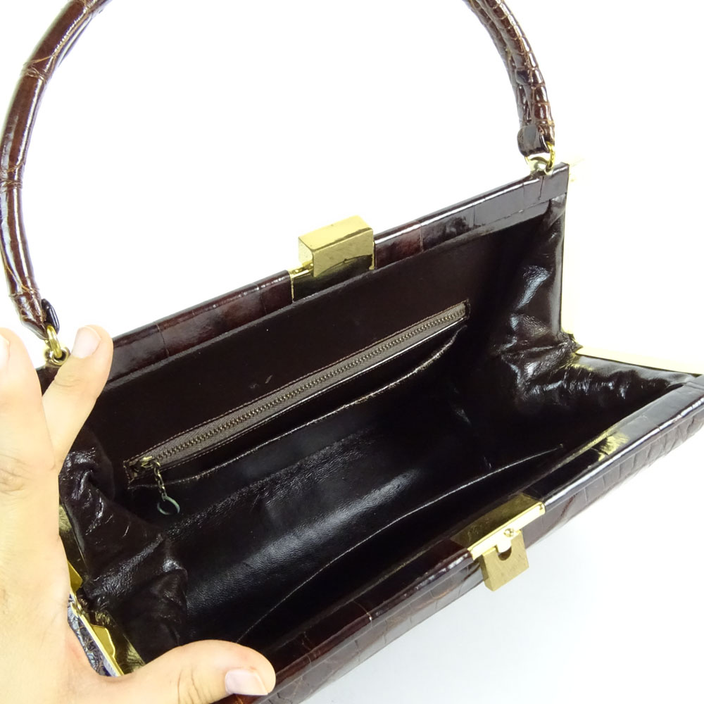 Vintage Alligator Handbag. Rich brown color with gold tone hardware.