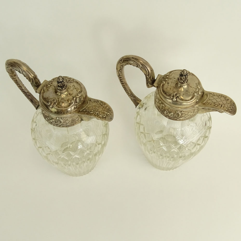 Pair of Victorian Silver Mounted Etched Crystal Ewers.