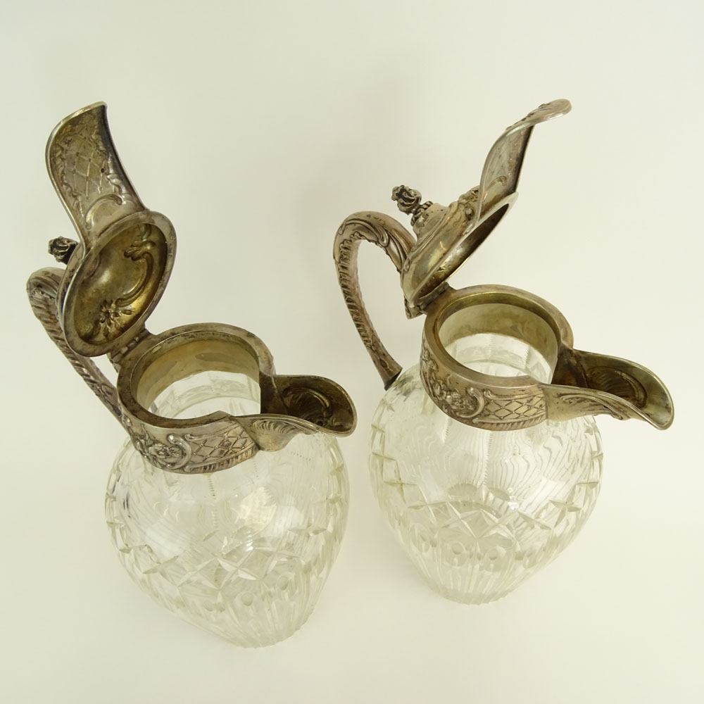 Pair of Victorian Silver Mounted Etched Crystal Ewers.