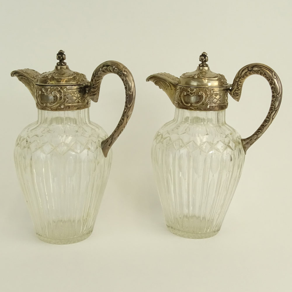 Pair of Victorian Silver Mounted Etched Crystal Ewers.