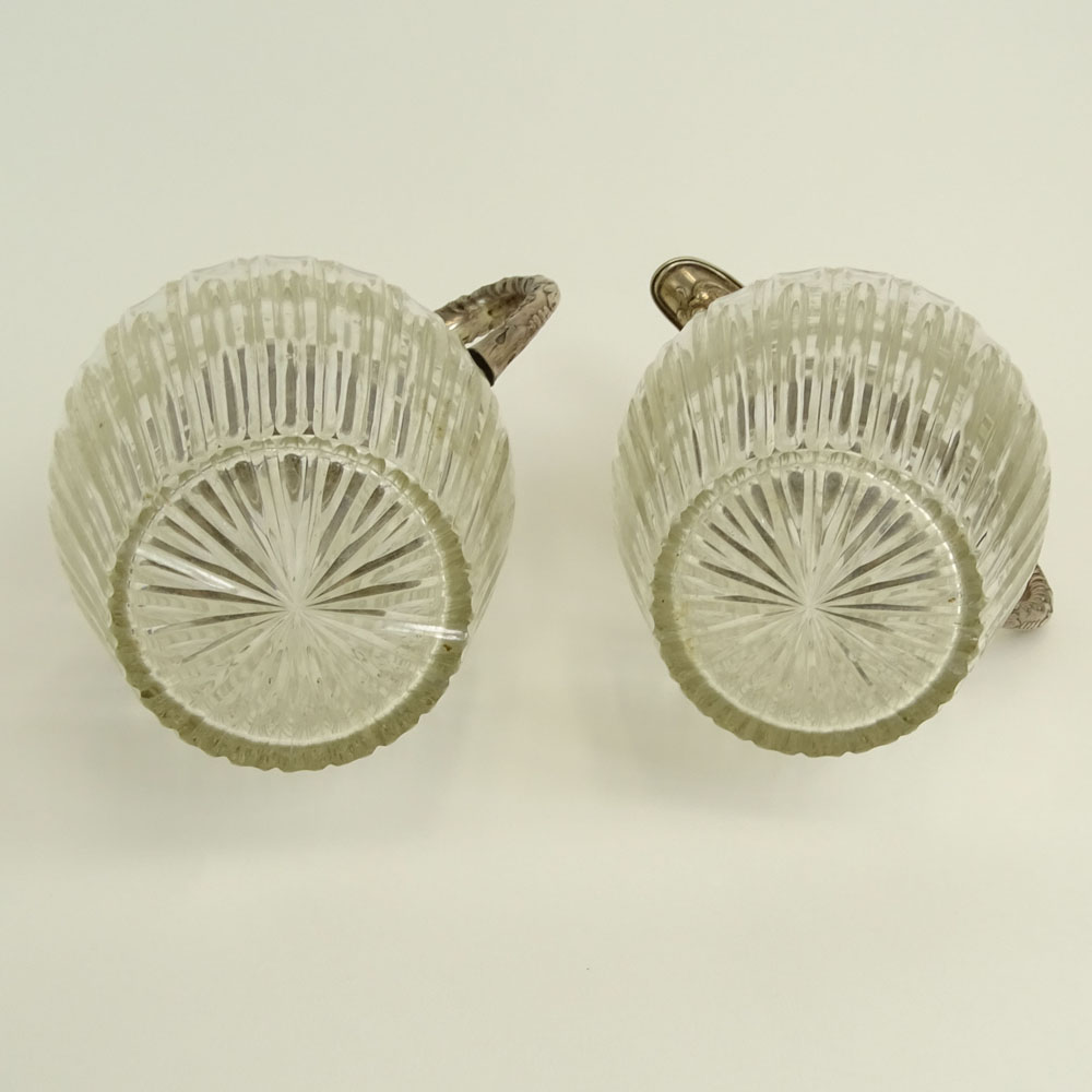 Pair of Victorian Silver Mounted Etched Crystal Ewers.