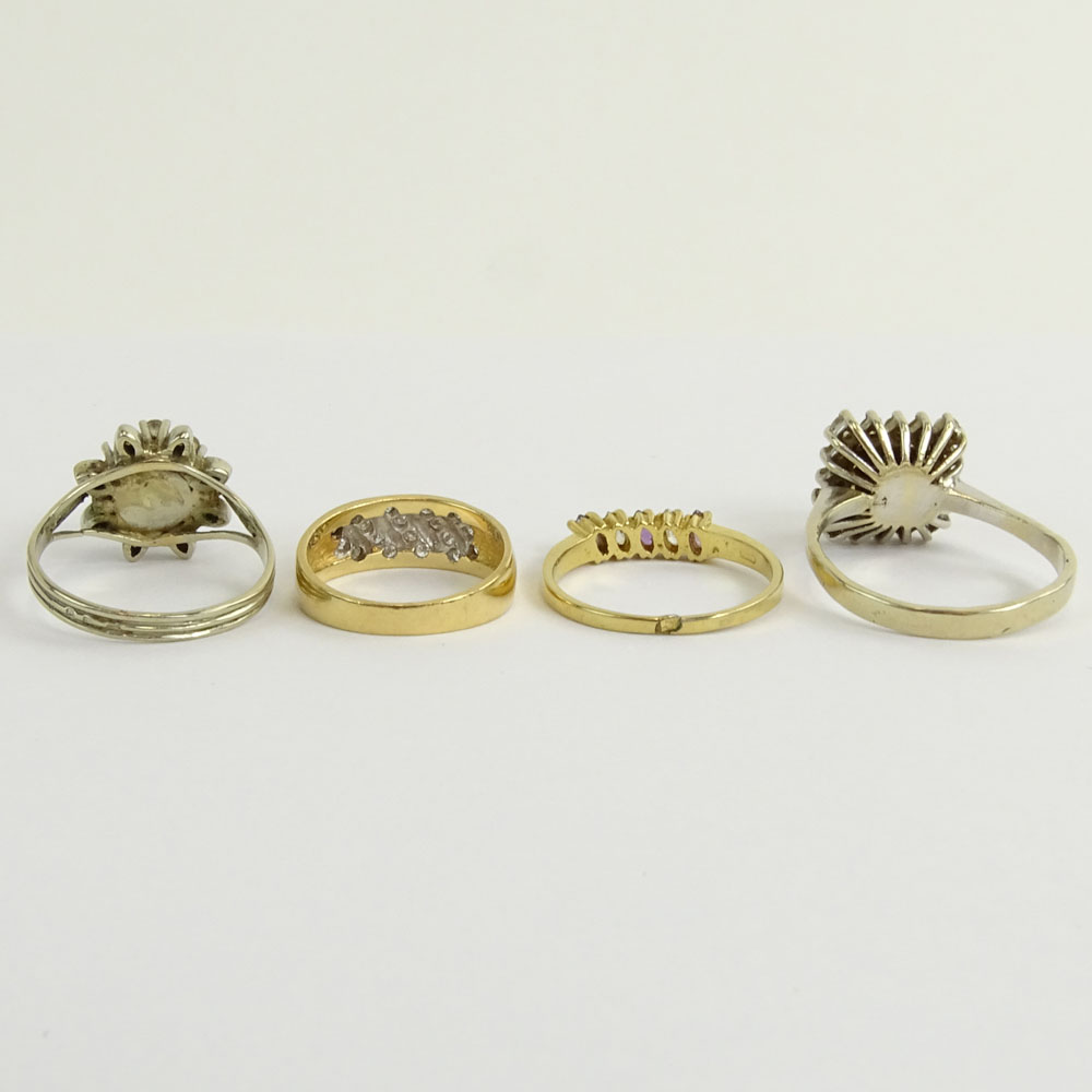 Collection of Four (4) Diamond and Gemstone Rings.