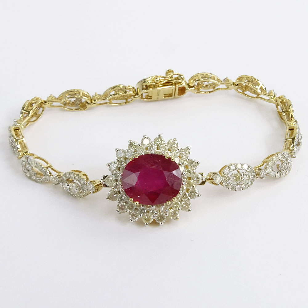 AIG Certified 7.45 Carat Oval Cut Ruby, 5.18 Carat Round Brilliant Cut Diamond and 14 Karat Yellow Gold Bracelet. 