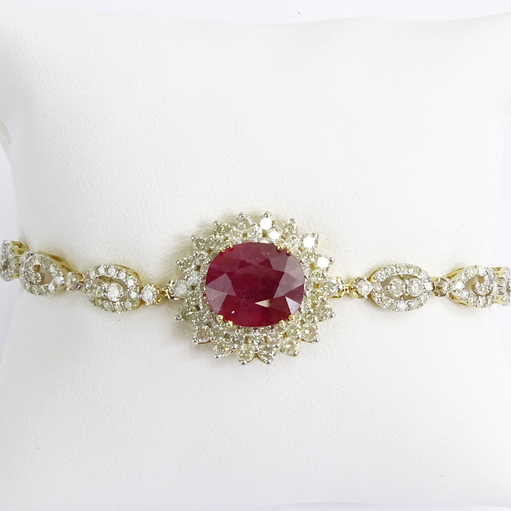 AIG Certified 7.45 Carat Oval Cut Ruby, 5.18 Carat Round Brilliant Cut Diamond and 14 Karat Yellow Gold Bracelet. 