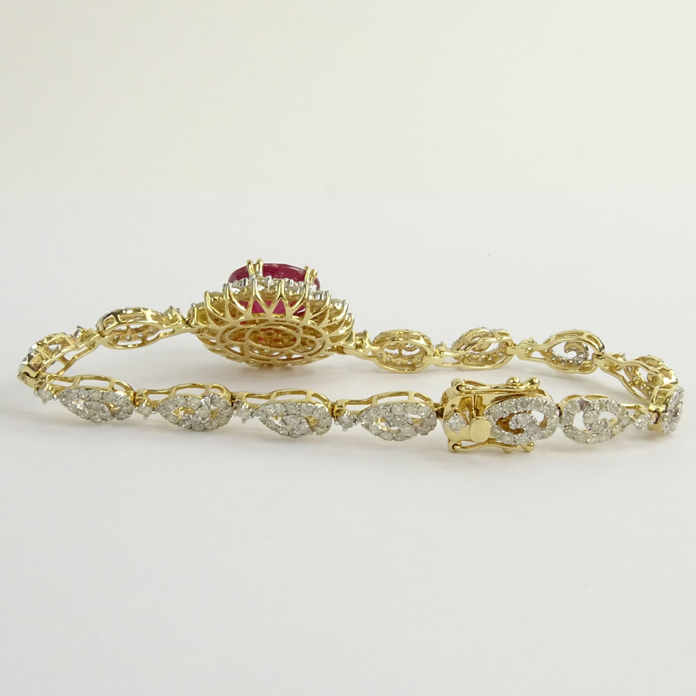 AIG Certified 7.45 Carat Oval Cut Ruby, 5.18 Carat Round Brilliant Cut Diamond and 14 Karat Yellow Gold Bracelet. 